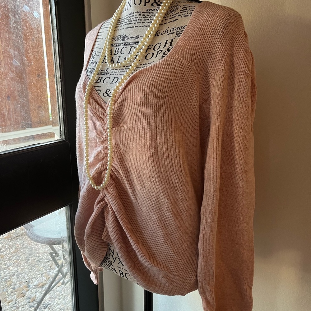 Chic Pink Sweater with Pearl Necklace